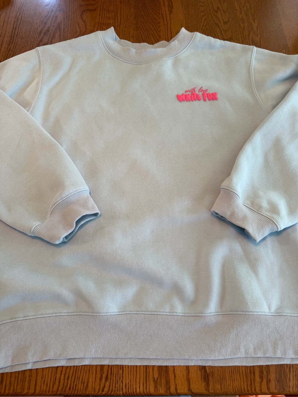 White Fox Light Blue Crewneck Sweatshirt with Pink Floral Logo